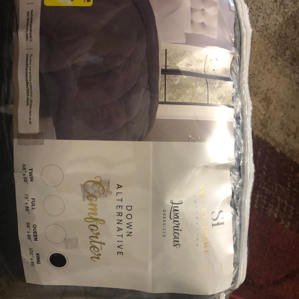 New In package Dark grey king size down alternative comforter.